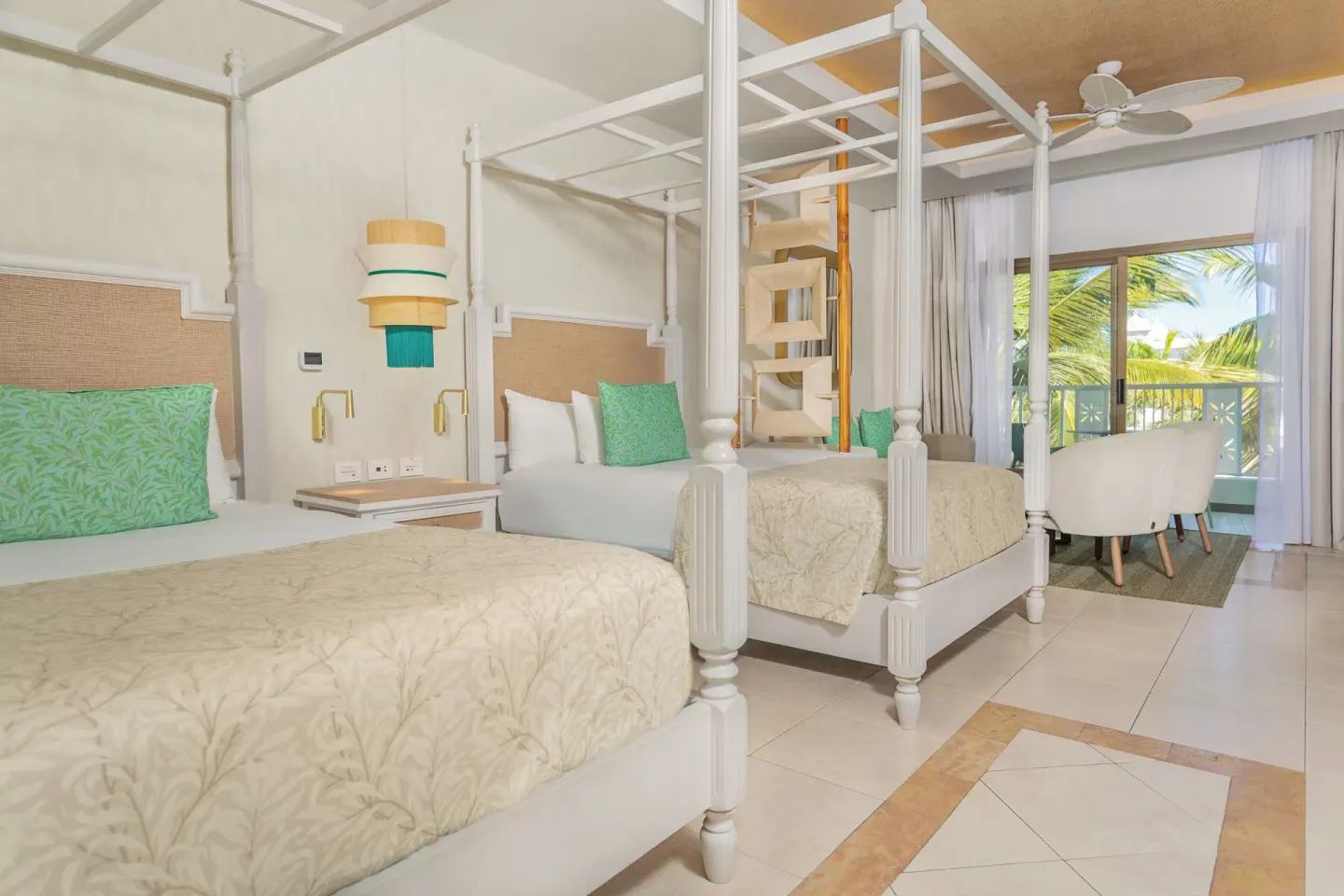 Junior Suite Deluxe canopy beds near a balcony at Bahia Principe Explore Esmeralda.