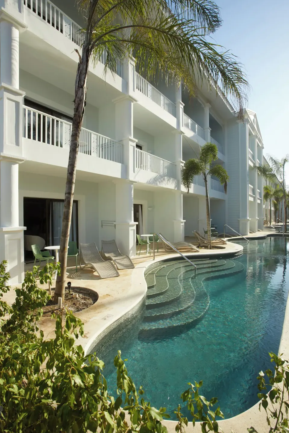 Swim-Up Junior Suite building and pool at Bahia Principe Explore Esmeralda.