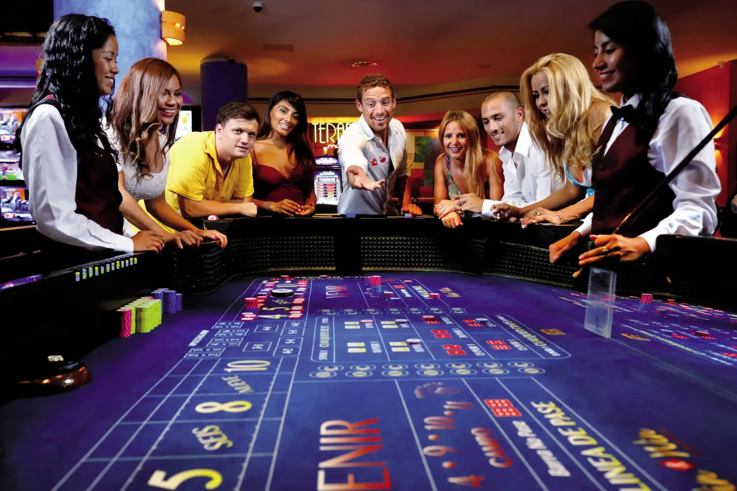 Guests gather around a casino table at Bahia Principe Explore Legend.