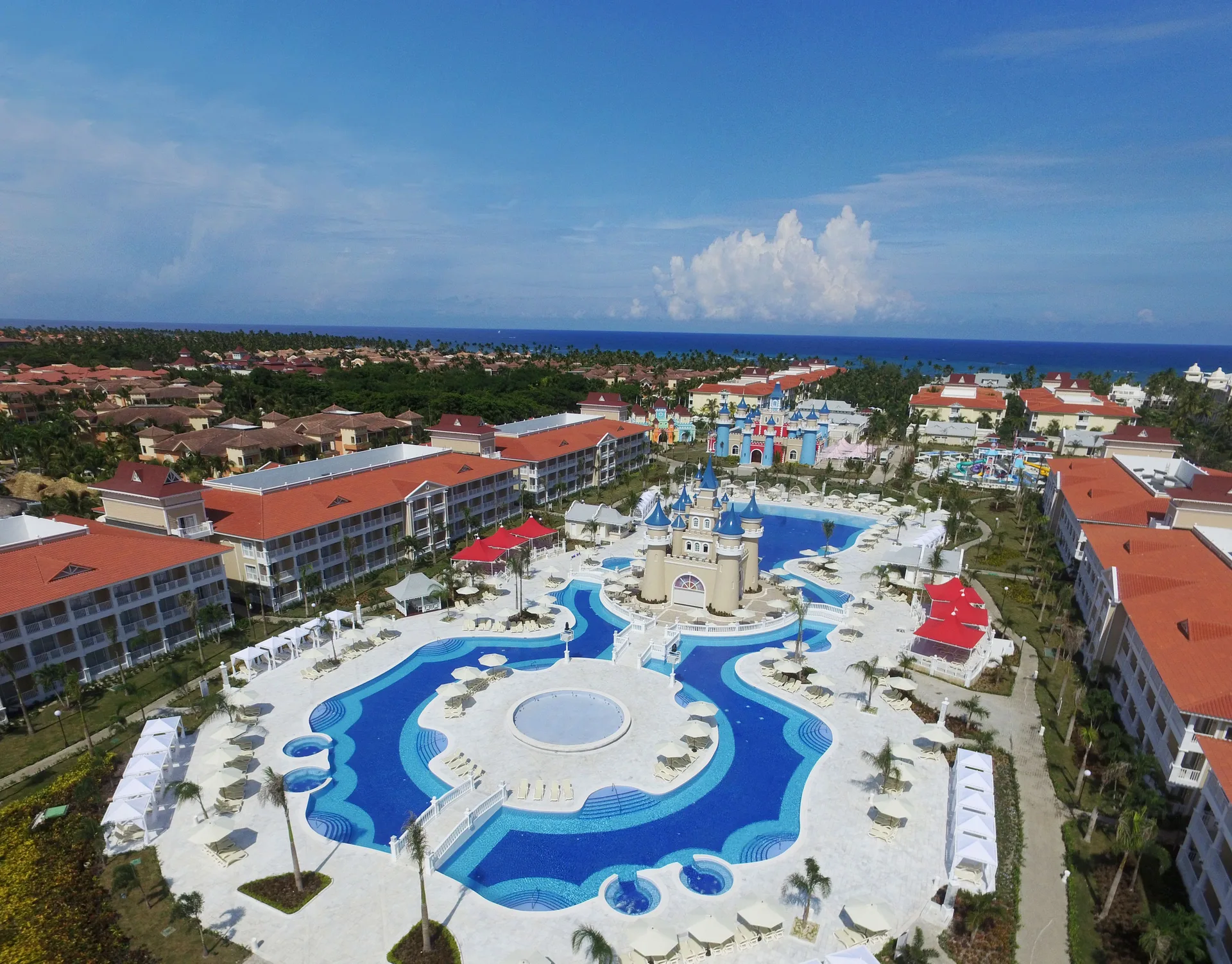 Aerial view of a castle-themed pool complex at Bahia Principe Explore Legend.