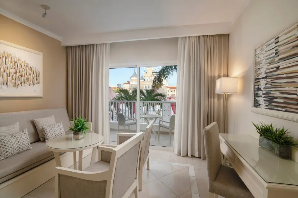 Junior Suite Castle View sitting area and balcony at Bahia Principe Explore Legend.