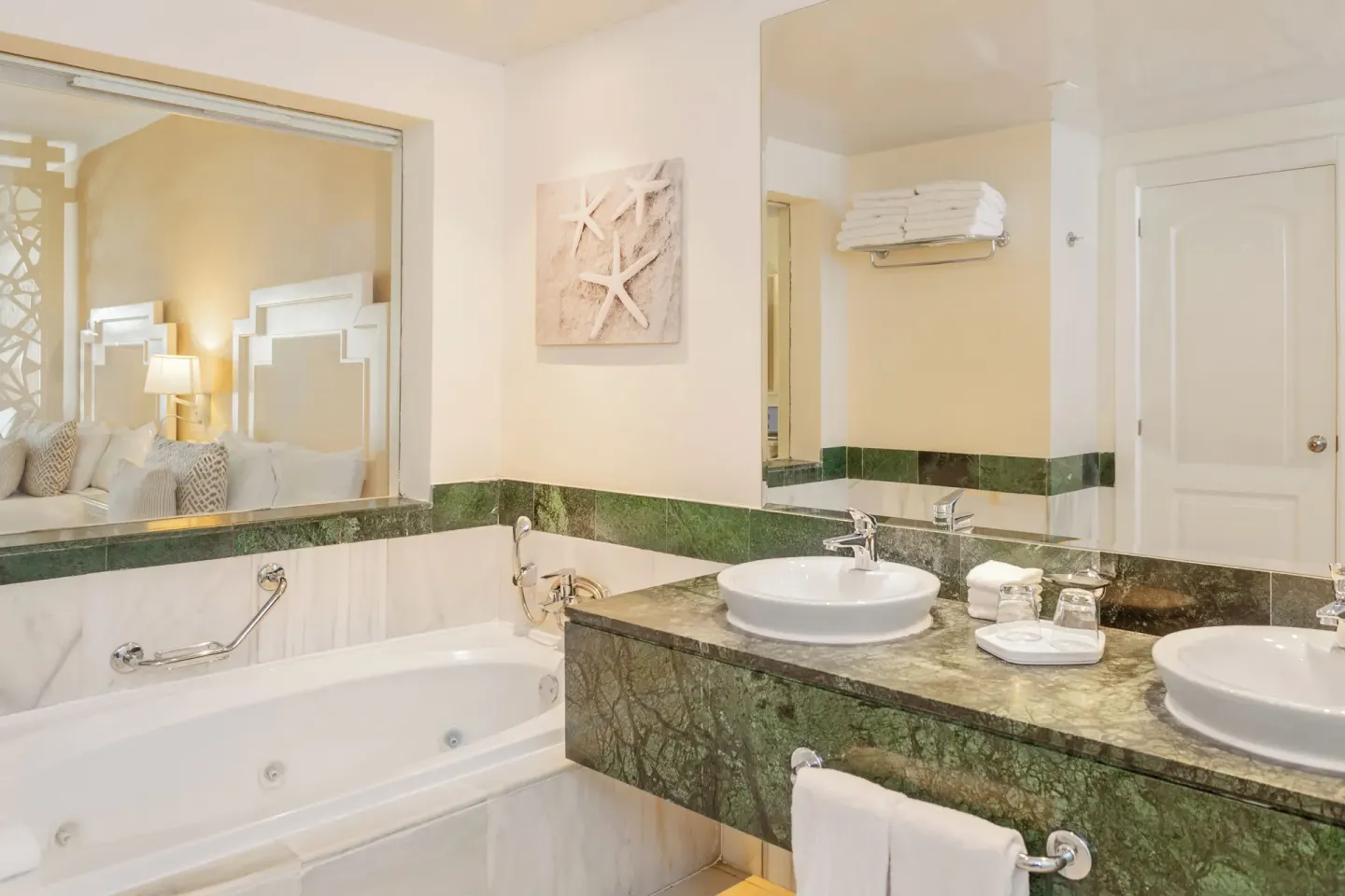 Junior Suite bathroom vanity and tub at Bahia Principe Explore Legend.
