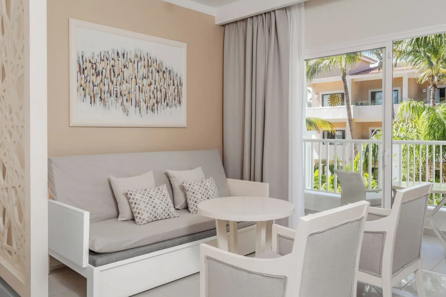 Junior Suite sitting area and balcony at Bahia Principe Explore Legend.