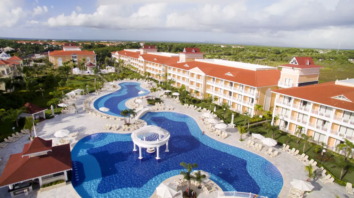 Aerial view of the large pool and guest buildings at Bahia Principe Grand Aquamarine.
