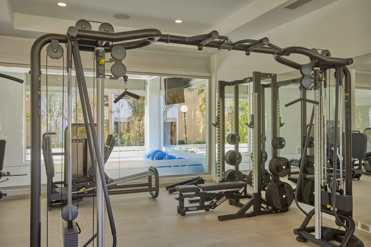 Cable station and weight equipment in the gym at Bahia Principe Grand Aquamarine.