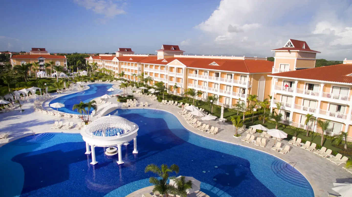 Pool complex with gazebo feature and guest-room balconies at Bahia Principe Grand Aquamarine.