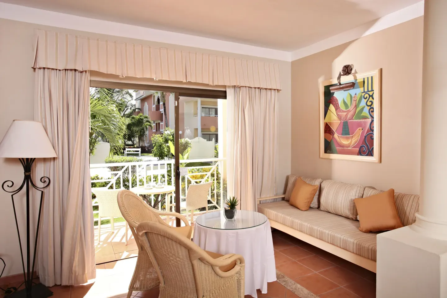 Junior Suite sitting area and balcony at Bahia Principe Grand Aquamarine.