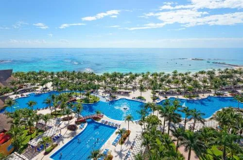 Barceló Maya Tropical family-friendly all-inclusive resort with tropical landscaping and large pool area in Xpu-Ha, Mexico.