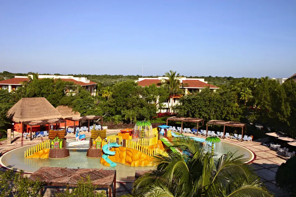 Aerial view of the resort's kids pool and surrounding sun loungers at Bahia Principe Grand Coba