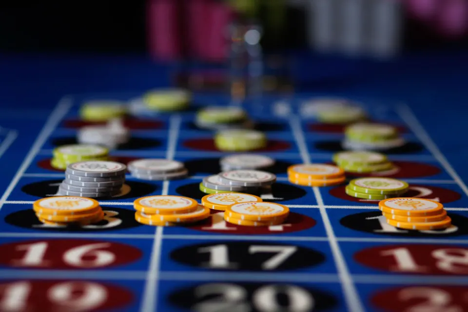 Close-up of casino betting chips on a roulette layout at Bahia Principe Grand Coba