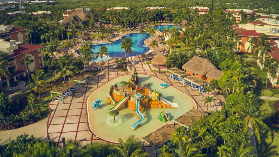 Aerial view of the resort showing a children's splash playground and pools at Bahia Principe Grand Coba