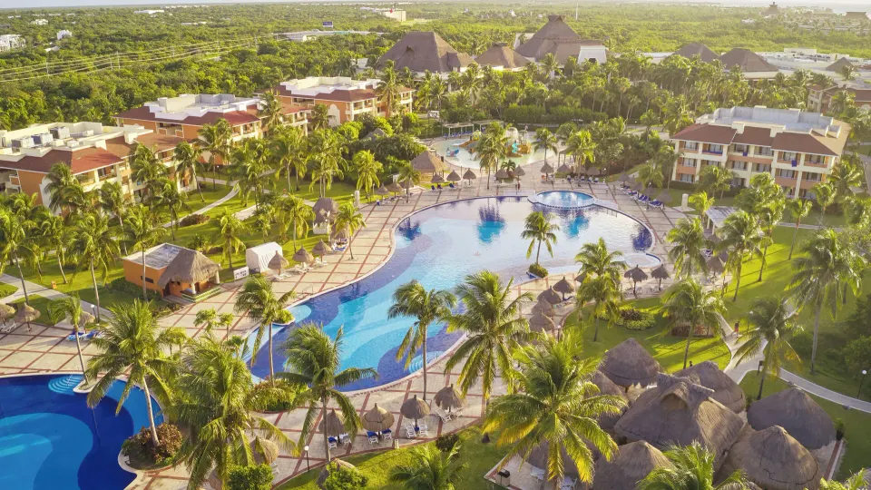Aerial view of resort pool and surrounding gardens at Bahia Principe Grand Coba