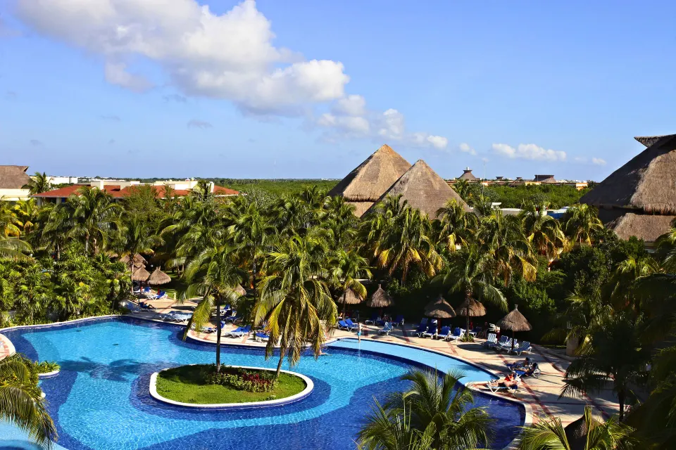White wide slide into the shallow kids pool at Bahia Principe Grand Coba