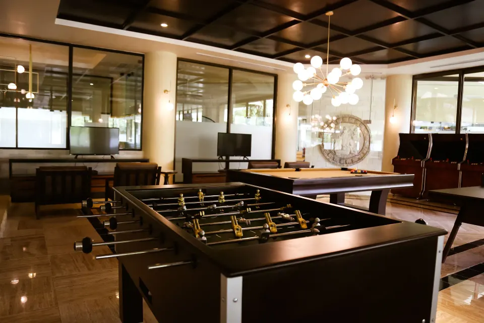Indoor games room with foosball and pool table at Bahia Principe Grand Coba