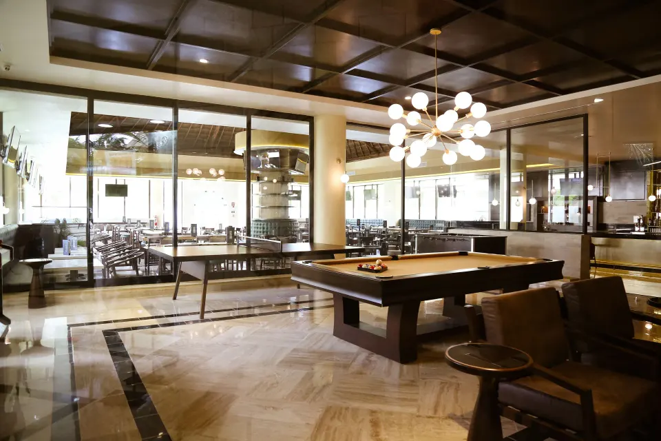 Open games and lounge space with pool table at Bahia Principe Grand Coba