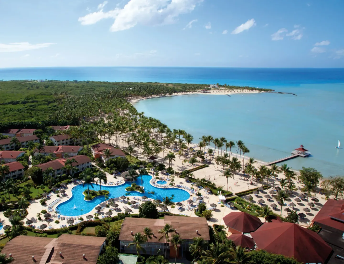 Aerial view of the pool, beach, and bay at Bahia Principe Grand La Romana.