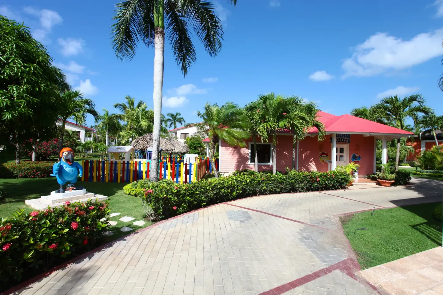 Colorful kids area and garden paths at Bahia Principe Grand La Romana.