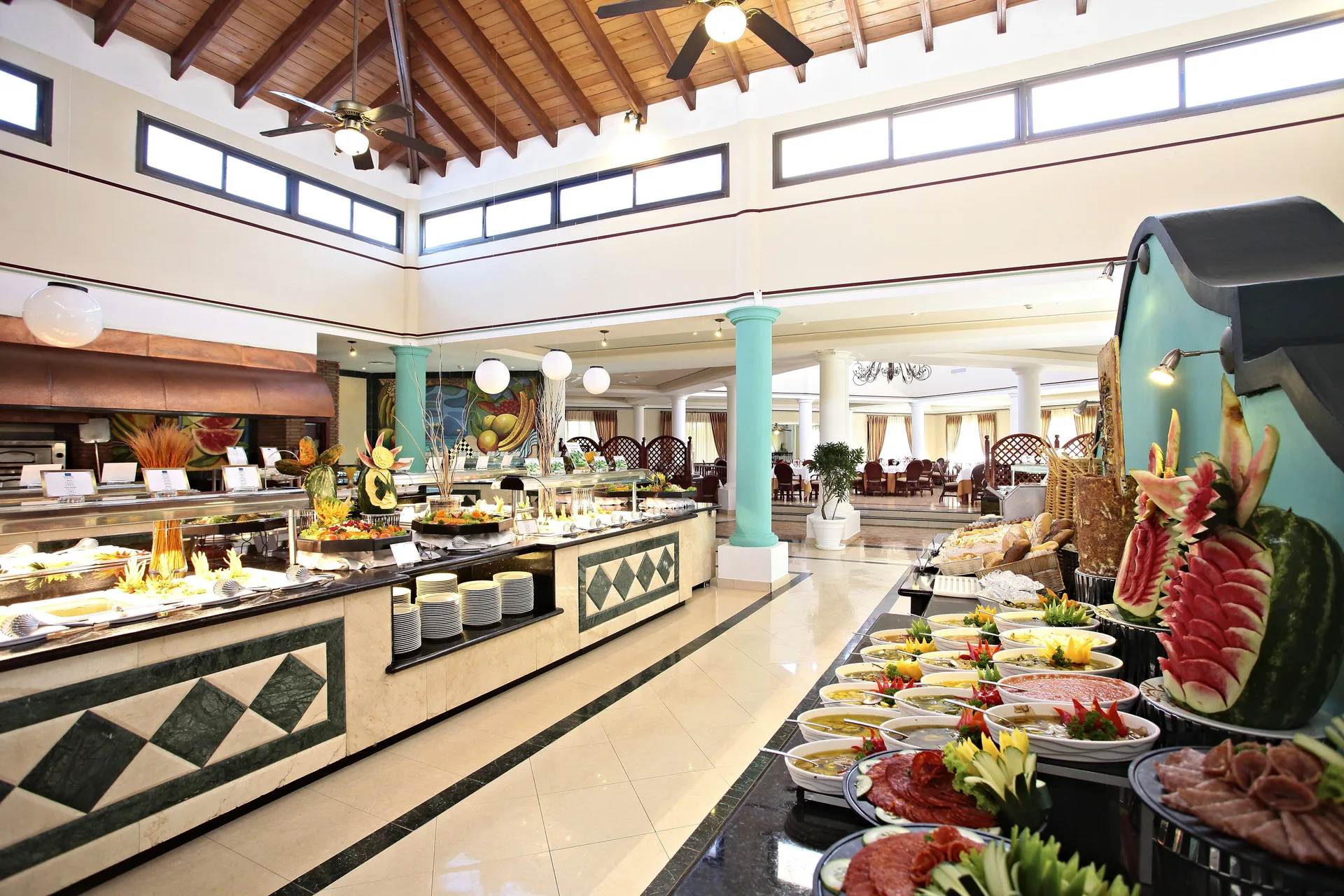 Buffet with carved fruit and cold platters at Bahia Principe Grand La Romana.