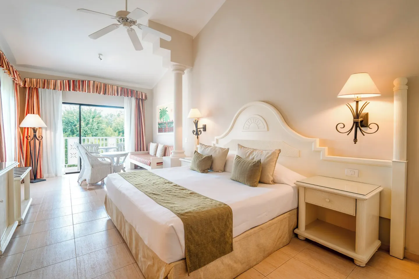 Junior Suite Oceanfront room with king bed and balcony at Bahia Principe Grand La Romana.