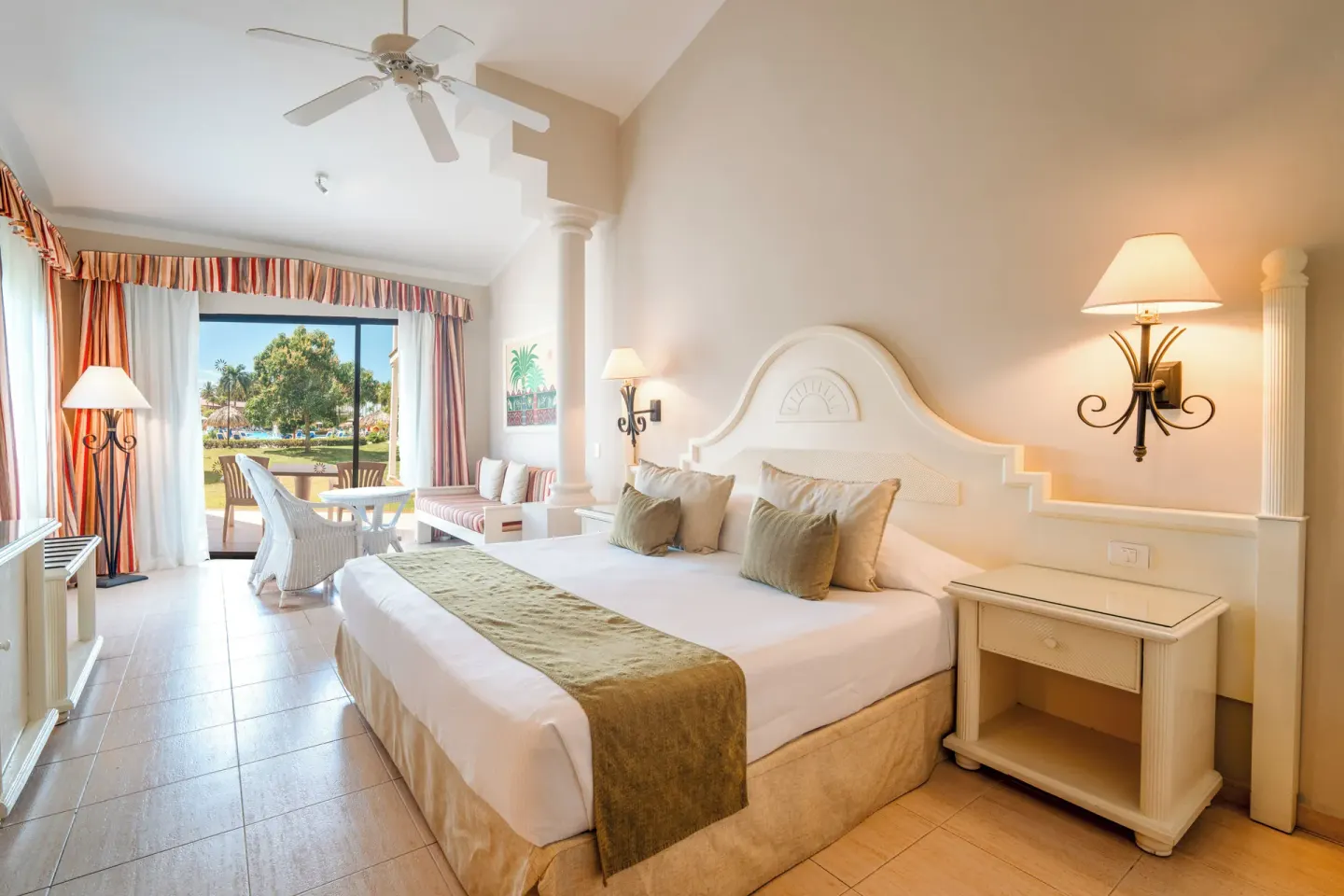 Junior Suite Oceanfront room with king bed and terrace view at Bahia Principe Grand La Romana.