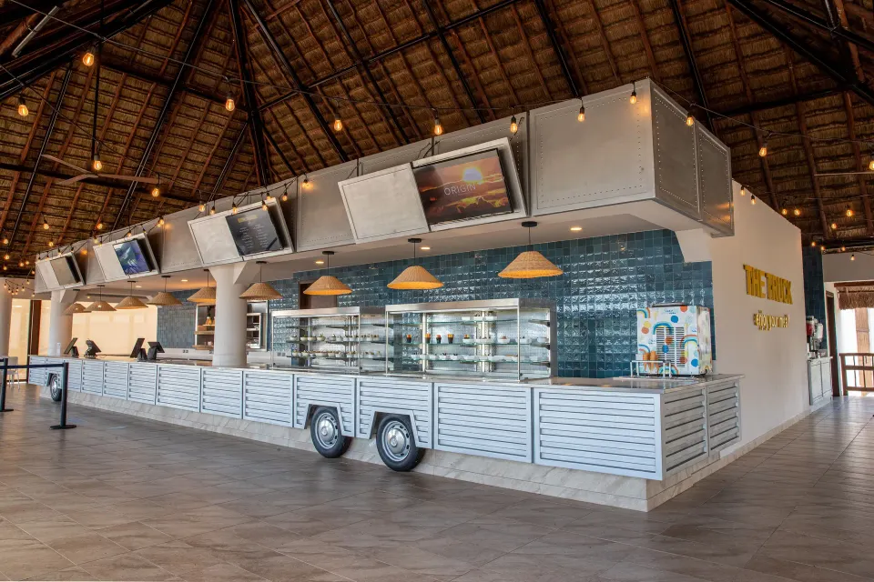 Open counter food truck-style bar area with wheels at Bahia Principe Grand Tulum