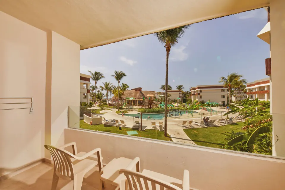 Balcony view overlooking the pool and grounds at Bahia Principe Grand Tulum from a 2 Bedroom Suite