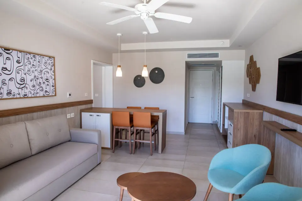 View of the living room and dining area in a 2 Bedroom Suite at Bahia Principe Grand Tulum