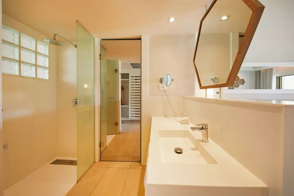 Bathroom vanity and walk-in shower in a Junior Suite at Bahia Principe Grand Tulum