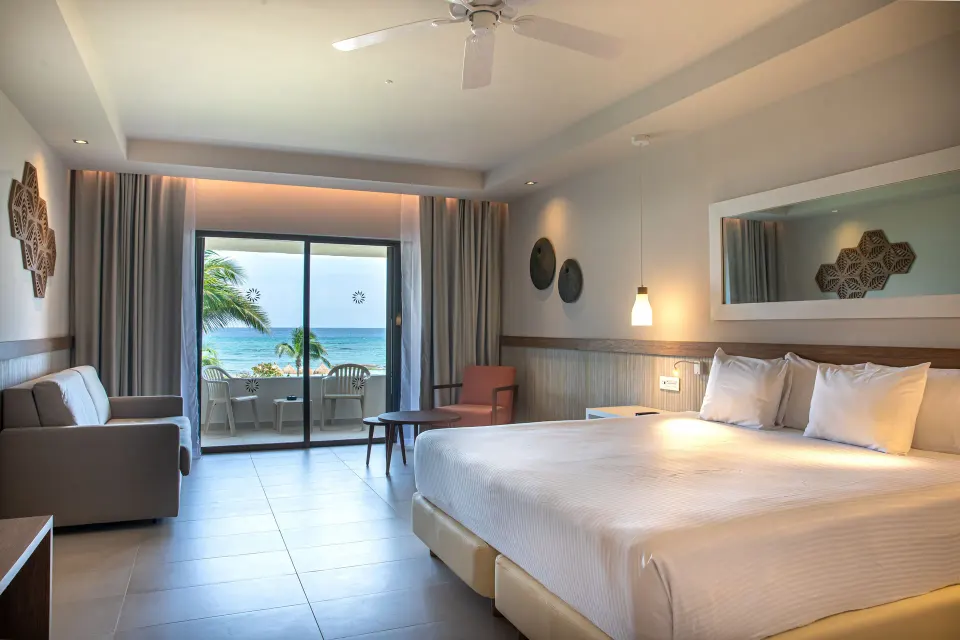 Premium Room (Superior 2+2) with ocean view from bed and balcony at Bahia Principe Grand Tulum