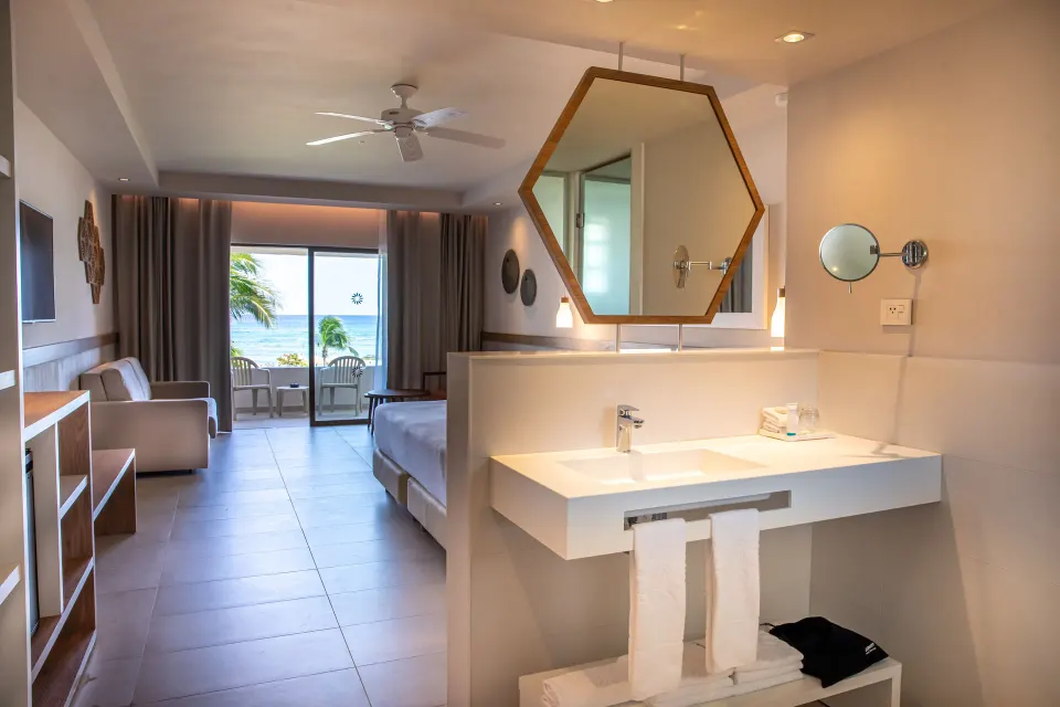 Open-plan Premium Room with vanity and balcony view at Bahia Principe Grand Tulum