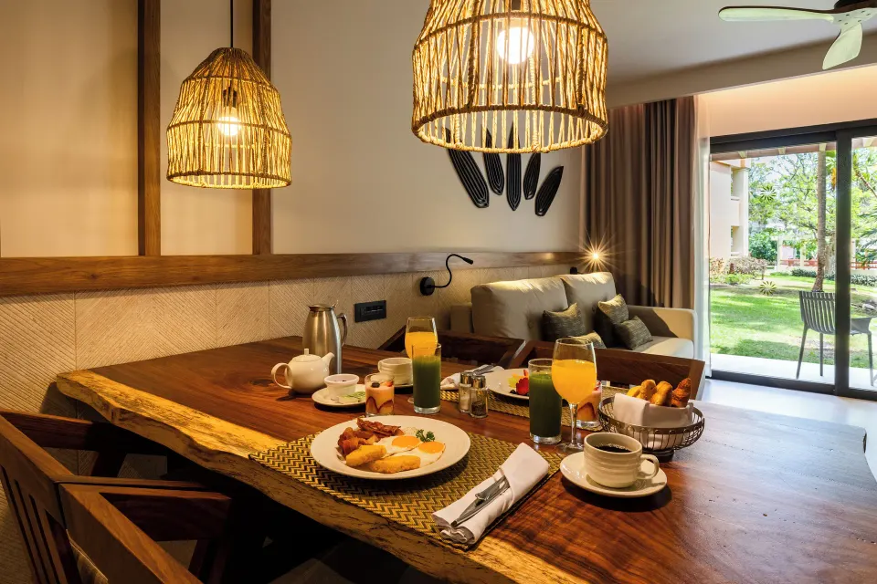 Dining table set with breakfast in a junior suite at Bahia Principe Luxury Akumal