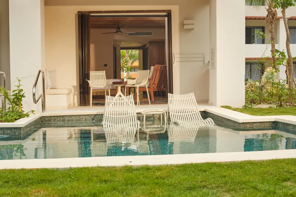 Private plunge pool and lounge chairs in front of a suite at Bahia Principe Luxury Akumal