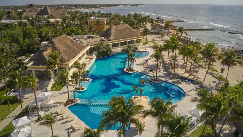 Aerial view of resort grounds and main pool at Bahia Principe Luxury Akumal.