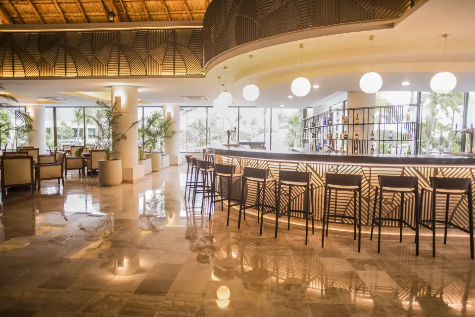Wide view of the resort's tiled floor and bar area at Bahia Principe Luxury Akumal