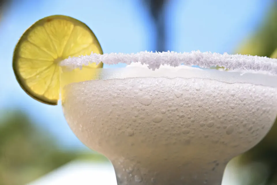 Frosted margarita glass with salted rim and lime garnish at Bahia Principe Luxury Akumal