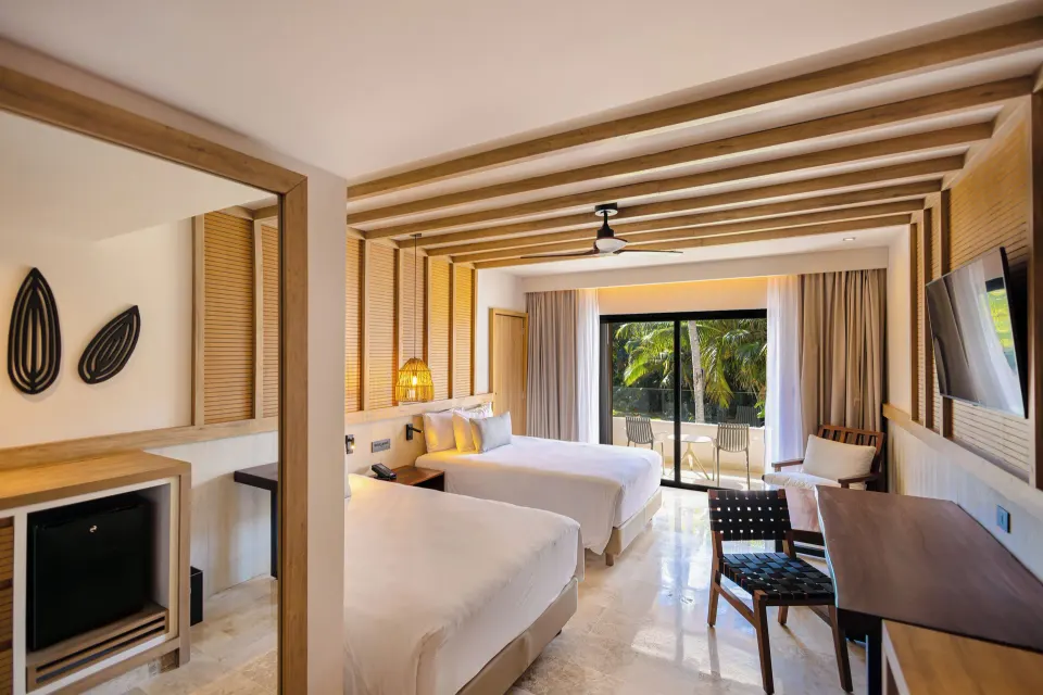 Junior Suite with two double beds and balcony at Bahia Principe Luxury Akumal