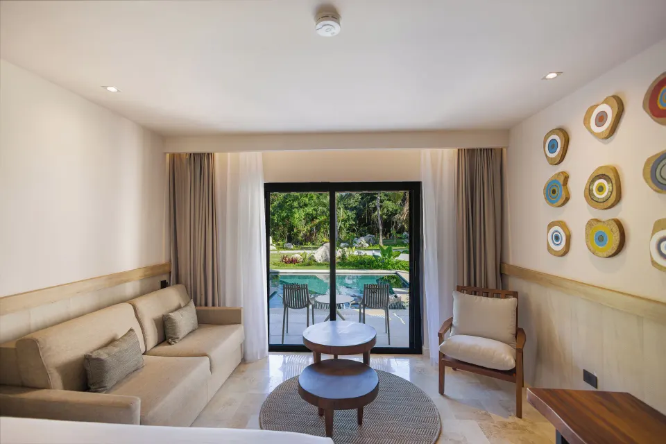 Junior Suite Swim Up lounge and sliding doors to private pool at Bahia Principe Luxury Akumal