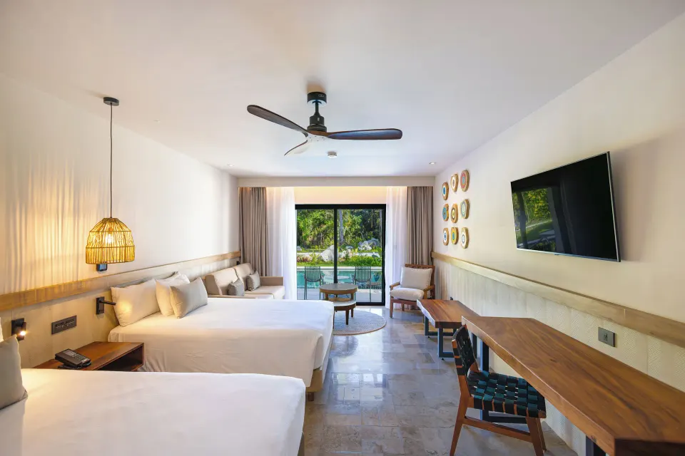 Junior Suite Swim Up with twin beds and pool view at Bahia Principe Luxury Akumal