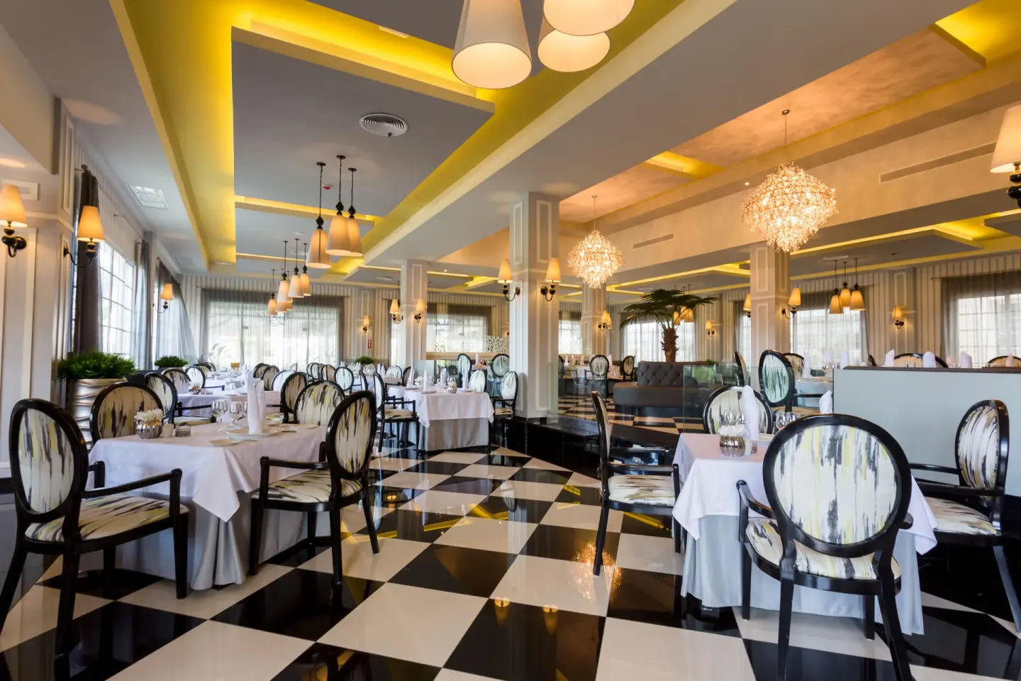 Bright dining room with checkered floor at Bahia Principe Luxury Bouganville.