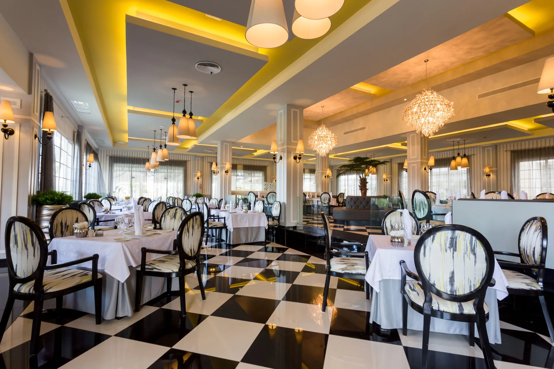Bright dining room with checkered floor at Bahia Principe Luxury Bouganville.