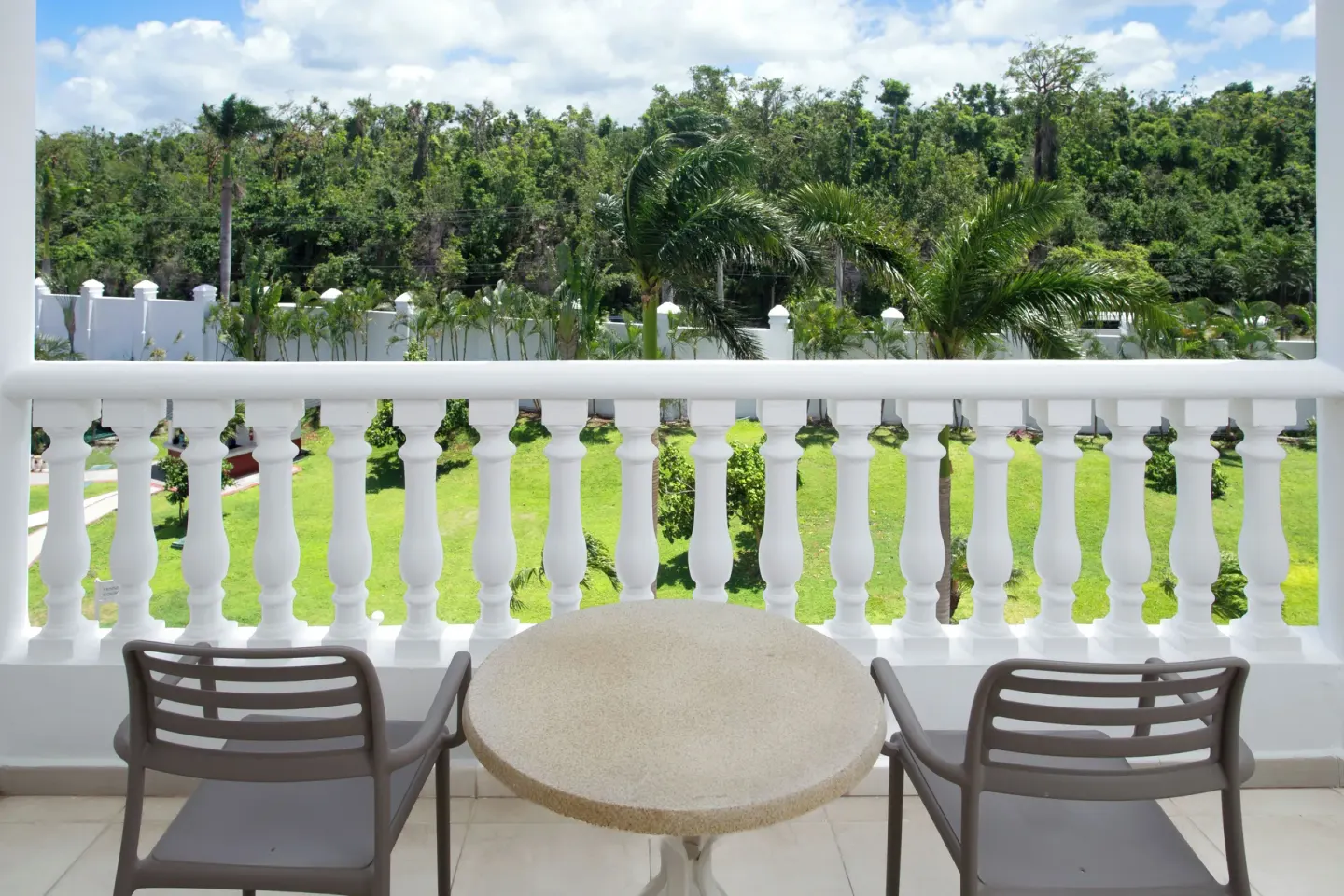 Junior Suite deluxe balcony seating at Bahia Principe Luxury Runaway Bay.