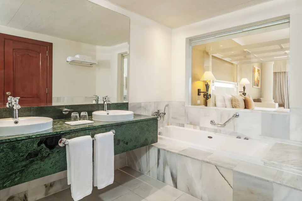 Junior Suite deluxe bathroom with twin sinks at Bahia Principe Luxury Runaway Bay.