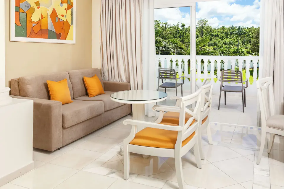 Junior Suite deluxe sitting area and balcony at Bahia Principe Luxury Runaway Bay.