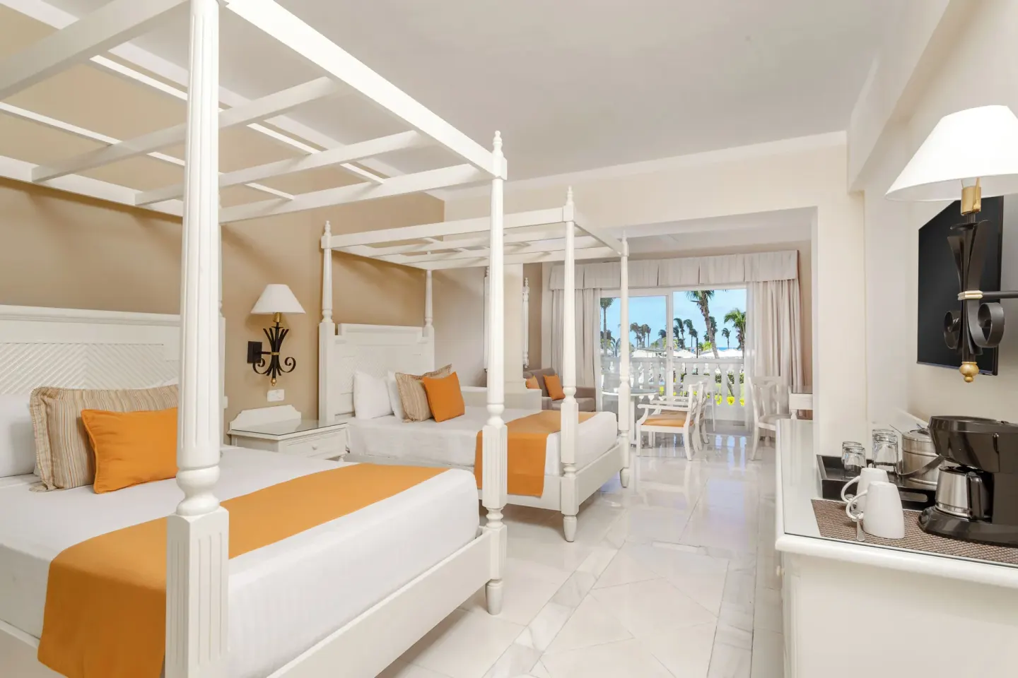 Junior Suite deluxe with two canopy beds at Bahia Principe Luxury Runaway Bay.