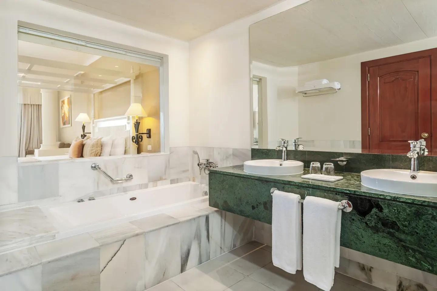 Junior Suite Sea View bathroom with tub and double sinks at Bahia Principe Luxury Runaway Bay.