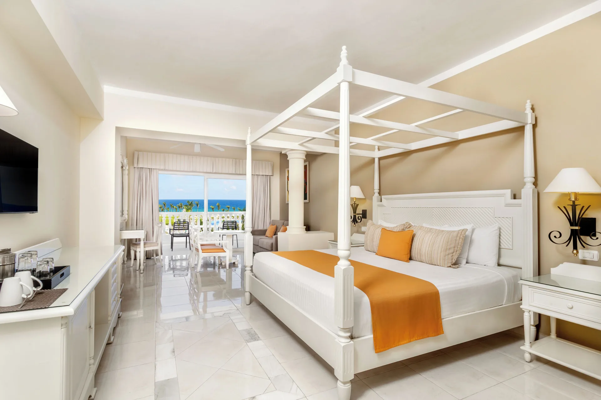 Junior Suite Sea View canopy bed and balcony ocean view at Bahia Principe Luxury Runaway Bay.