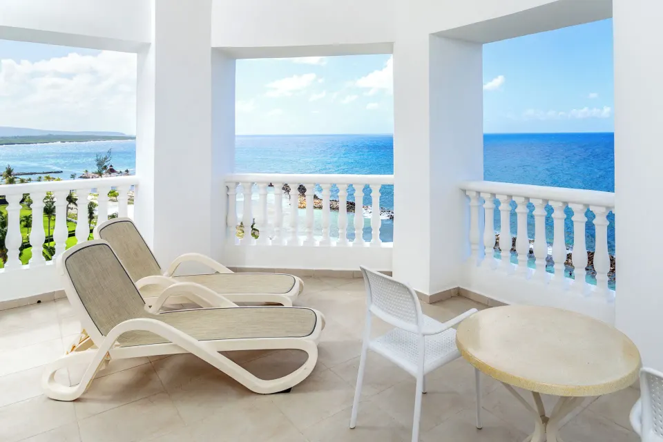 Junior Suite Sea View terrace with loungers and ocean views at Bahia Principe Luxury Runaway Bay.