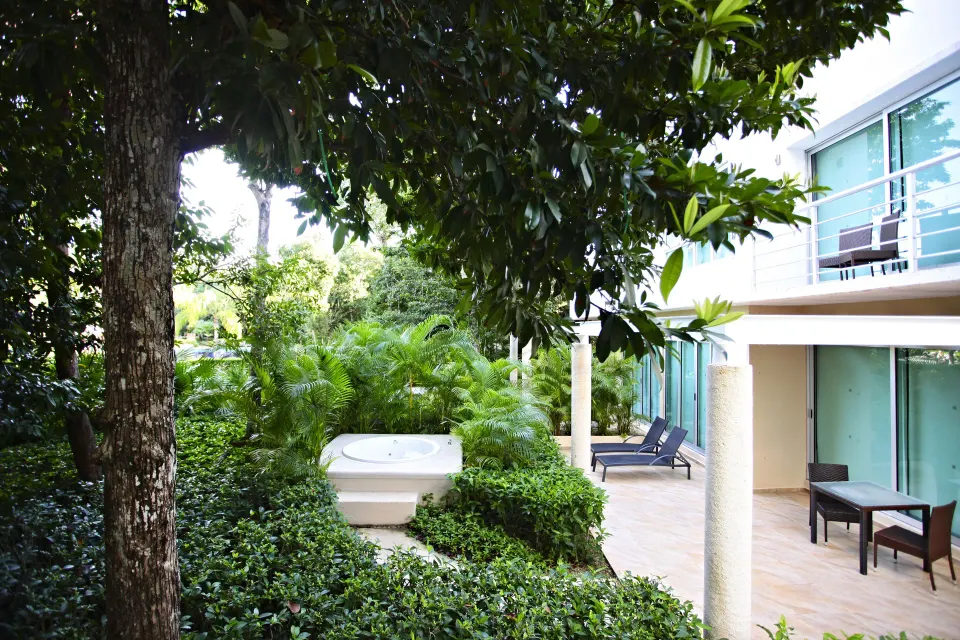 Ground-floor suite terrace with private tub and garden at Bahia Principe Luxury Sian Ka'an
