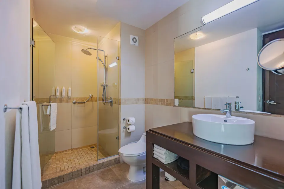 Junior Suite bathroom with glass shower and vanity at Bahia Principe Luxury Sian Ka'an