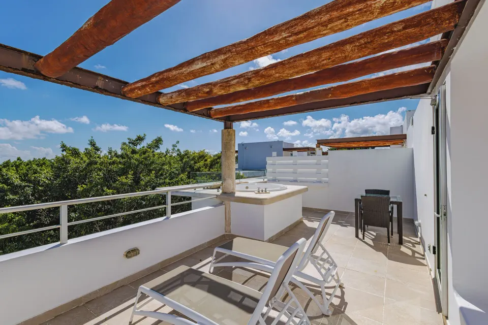 Penthouse terrace with sun loungers, pergola and treetop views at Bahia Principe Luxury Sian Ka'an